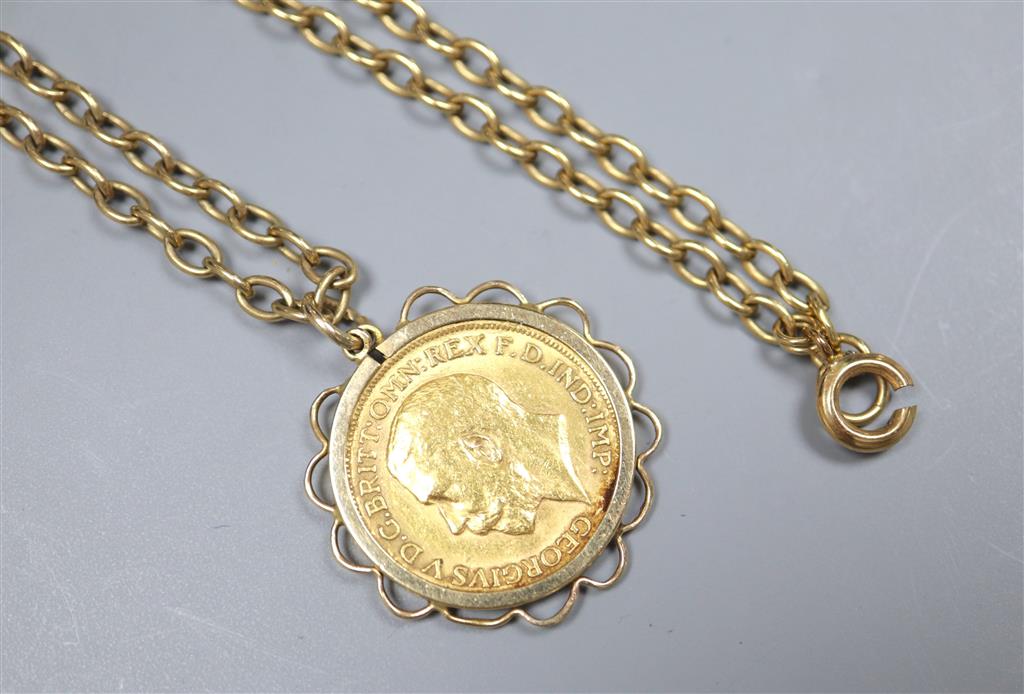 A George V 1911 gold sovereign, in yellow metal pendant mount, on a 9ct chain,